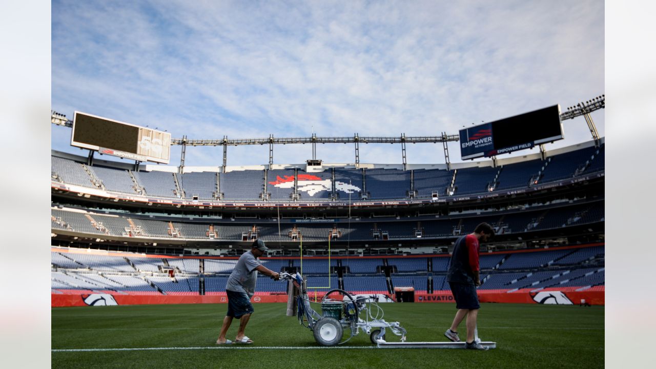 Painting a Broncos Hall of Fame wall at the Empower Field on the Team store.  : r/DenverBroncos