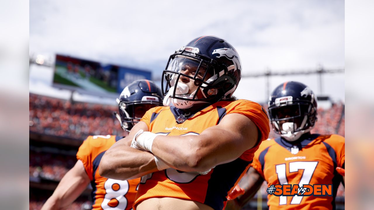 Denver Broncos running back Phillip Lindsay (30) shares a laugh with Las  Vegas Raiders running …