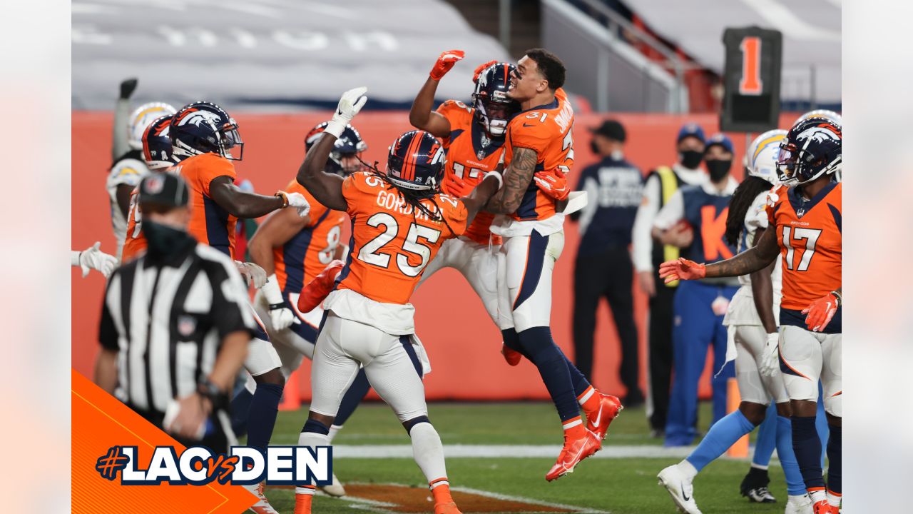 Denver, Colorado, USA. 1st Dec, 2019. Broncos RB PHILLIP LINDSAY starts to  take off his jersey to exchange with a Chargers player during the end of  the game at Empower Field At