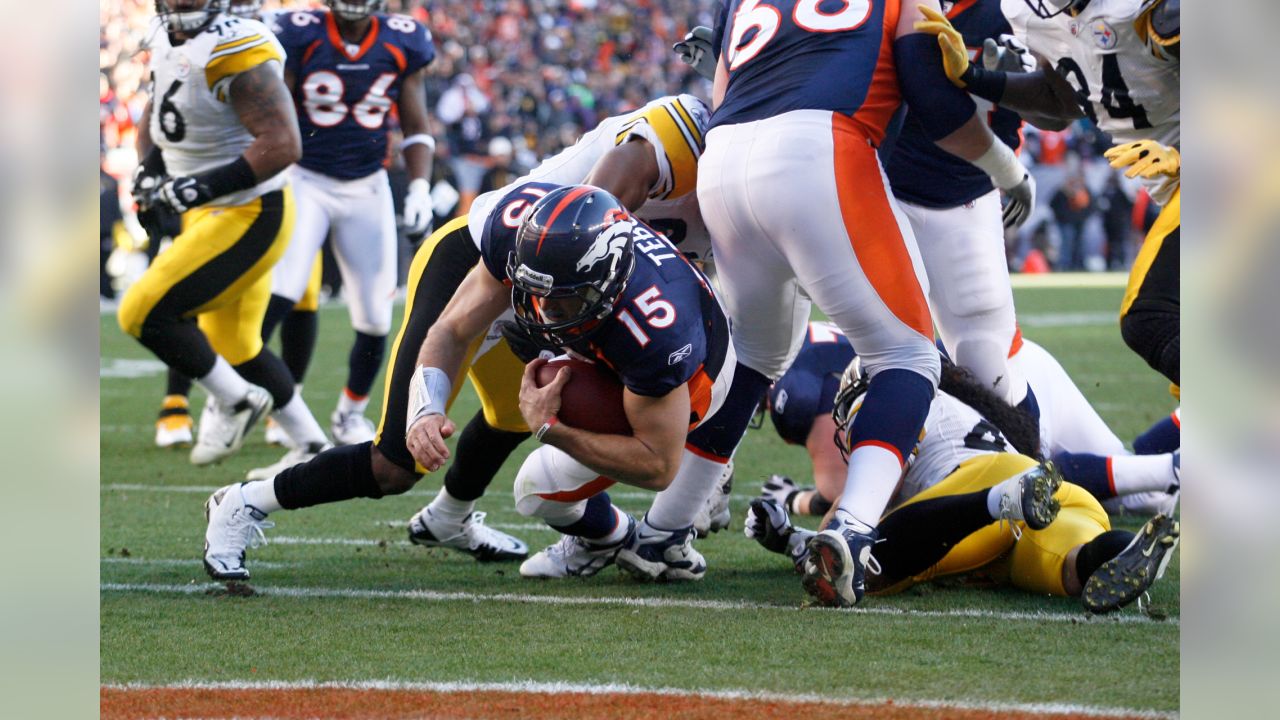 Jan. 8, 2012 - Denver, CO, USA - Denver Broncos QB TIM TEBOW runs for big  yardage against the Steelers during the 1st. half at Sports Authority Field  at Mile High Sunday