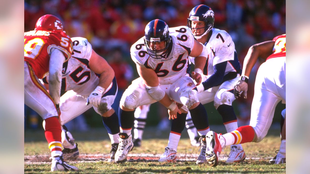 Denver Broncos lineman Dwayne Carswell, right, catches his first