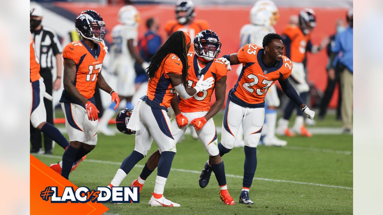 Denver, Colorado, USA. 1st Dec, 2019. Broncos RB PHILLIP LINDSAY starts to  take off his jersey to exchange with a Chargers player during the end of  the game at Empower Field At