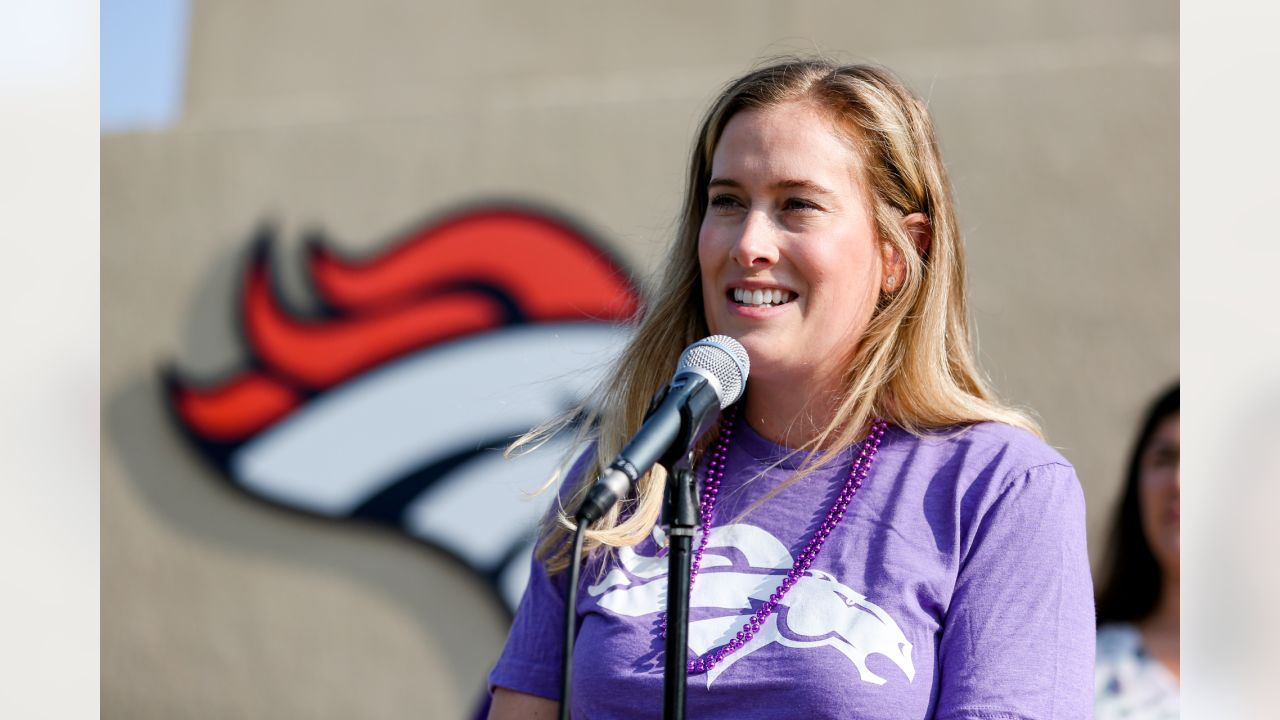 Brittany Bowlen, center, chats with George Paton, right, general manager of  the Denver Broncos, and Nancy Thompson during a news conference to raise  awareness of Alzheimer's disease outside the team's headquarters Wednesday