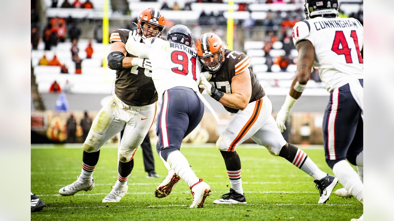 Cleveland Browns wide receiver Derrick Willies (84) holds off Cleveland  Browns defensive back Sheldrick Redwine (33) after a pass reception during  practice at the NFL football team's training facility Wednesday, July 31