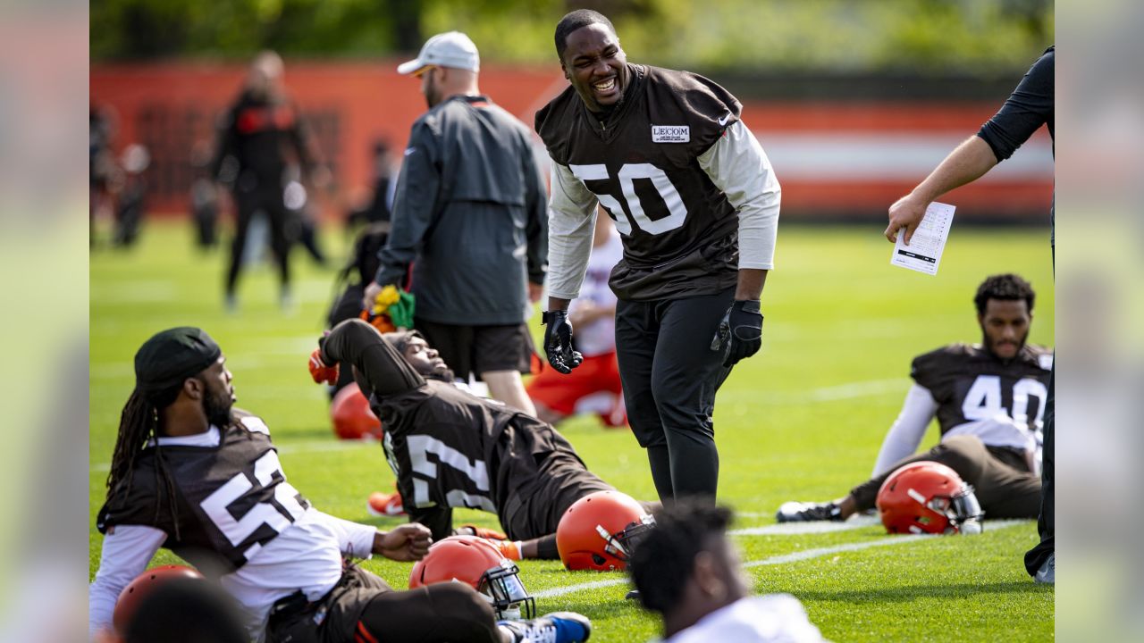 Cleveland Browns defensive end Chris Smith (50) stands with