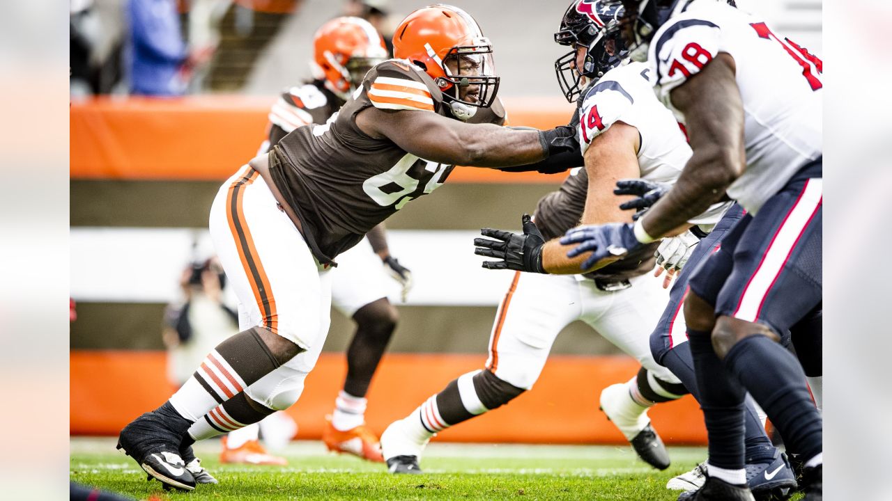 Cleveland Browns wide receiver Derrick Willies (84) holds off Cleveland  Browns defensive back Sheldrick Redwine (33) after a pass reception during  practice at the NFL football team's training facility Wednesday, July 31