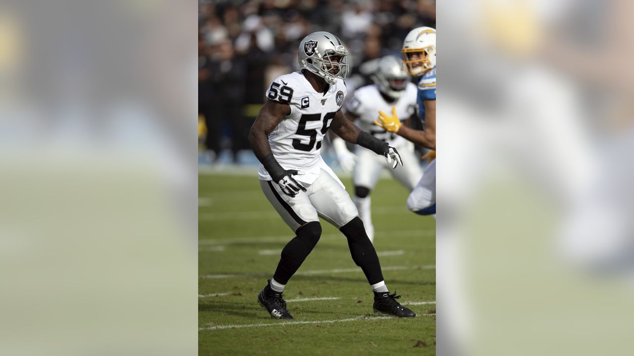 Raiders inside linebacker Cory Littleton (42) stops Miami Dolphins