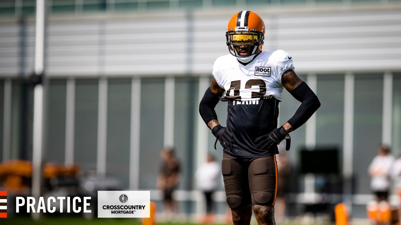 Cleveland Browns offensive tackle James Hudson III (66) walks back