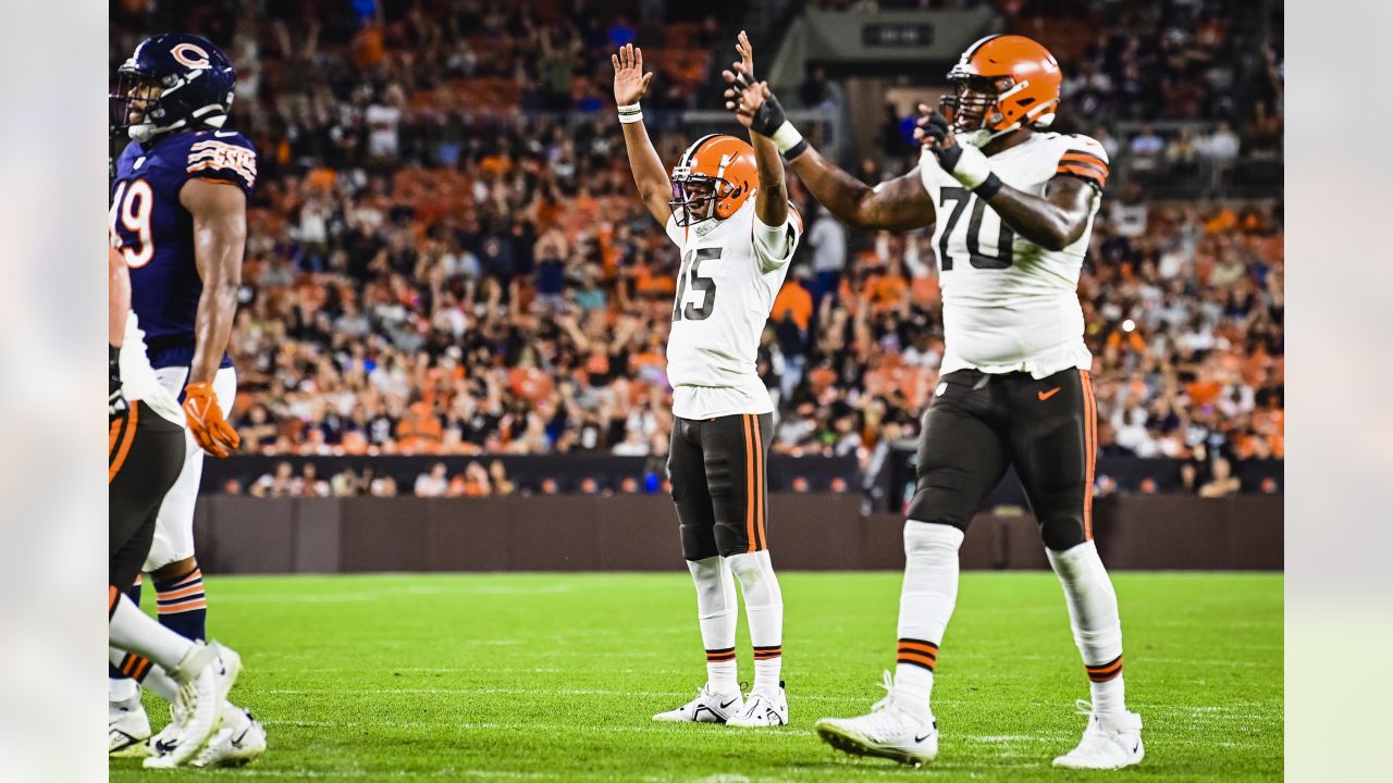 NFL field judge Nate Jones stands between players during an NFL preseason  football game between the Cleveland Browns and the Chicago Bears, Saturday,  Aug. 27, 2022, in Cleveland. The Bears won 21-20. (