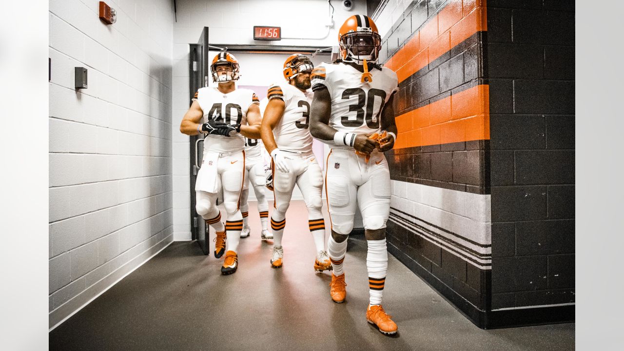 Cleveland Browns defensive tackle Malik Jackson (97) and defensive end  Myles Garrett (95) walk off the field after an NFL football game against  the Denver Broncos, Thursday, Oct. 21, 2021, in Cleveland.