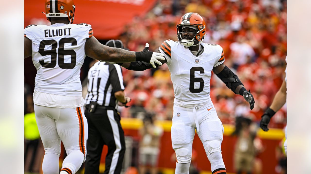 Cleveland Browns cornerback Caleb Biggers celebrates after intercepting a  pass and running it back for a touchdown during the first half of an NFL  preseason football game against the Kansas City Chiefs