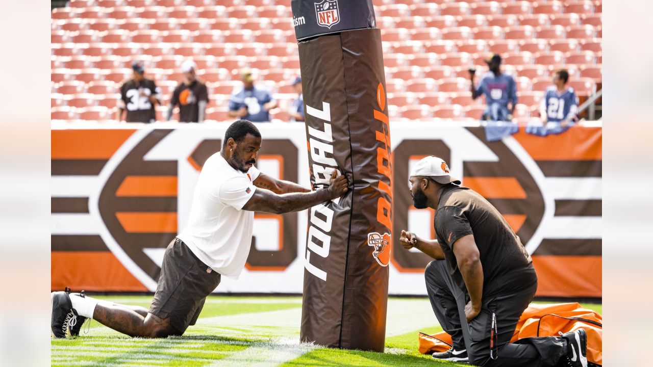 Cleveland Browns defensive tackle Malik Jackson (97) and defensive end  Myles Garrett (95) walk off the field after an NFL football game against  the Denver Broncos, Thursday, Oct. 21, 2021, in Cleveland.