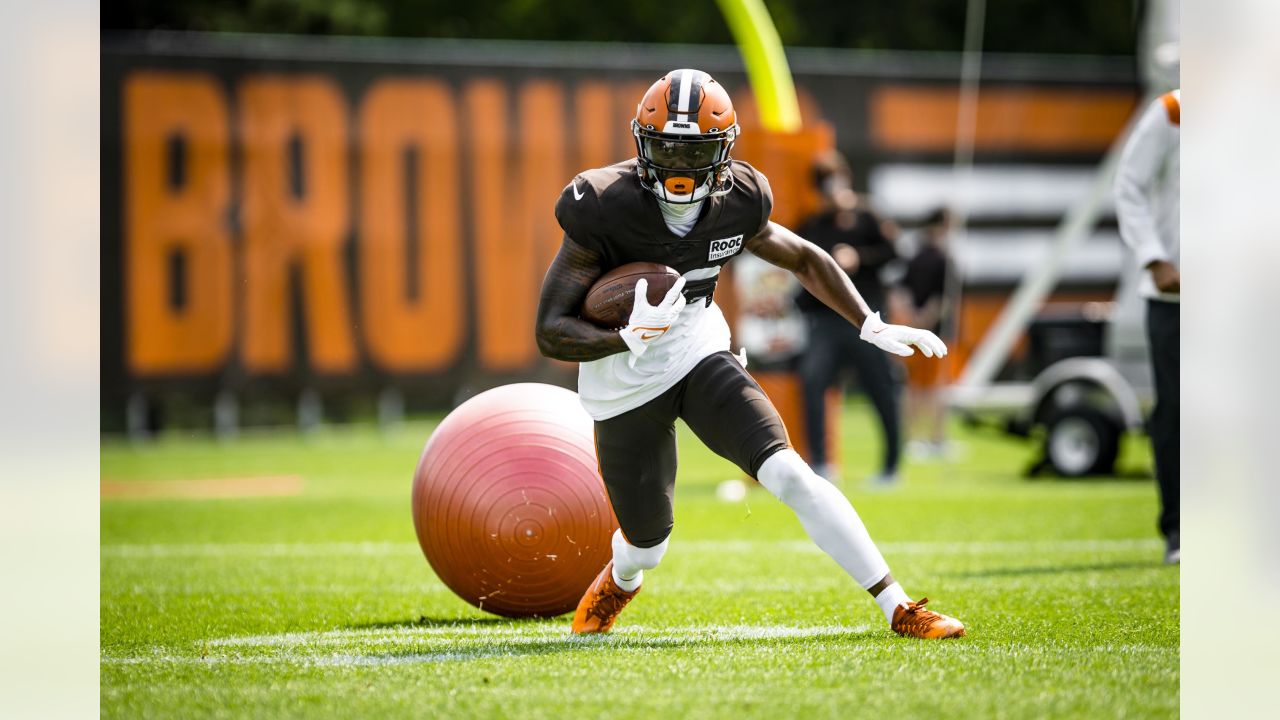 Cleveland Browns offensive tackle James Hudson III (66) walks back