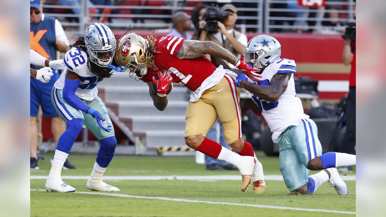 Aug 29, 2019: Dallas Cowboys cornerback Donovan Olumba #32 carries the ball  back for a touchdown after making an interception in the first quarter  during an NFL preseason game between the Tampa