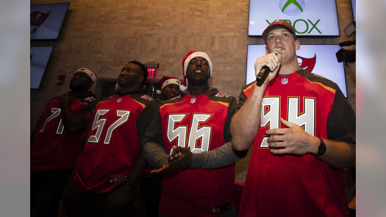 Bucs D-Line delivers special Christmas for kids