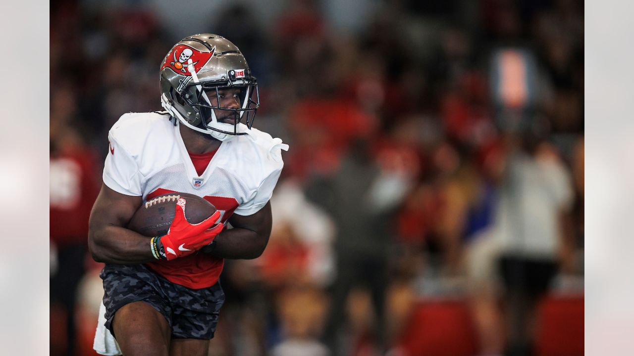 TAMPA, FL - JUL 30: Tampa Bay Buccaneers runningback Leonard Fournette (7)  carries the ball during the Tampa Bay Buccaneers Training Camp on July 30,  2022 at the AdventHealth Training Center at