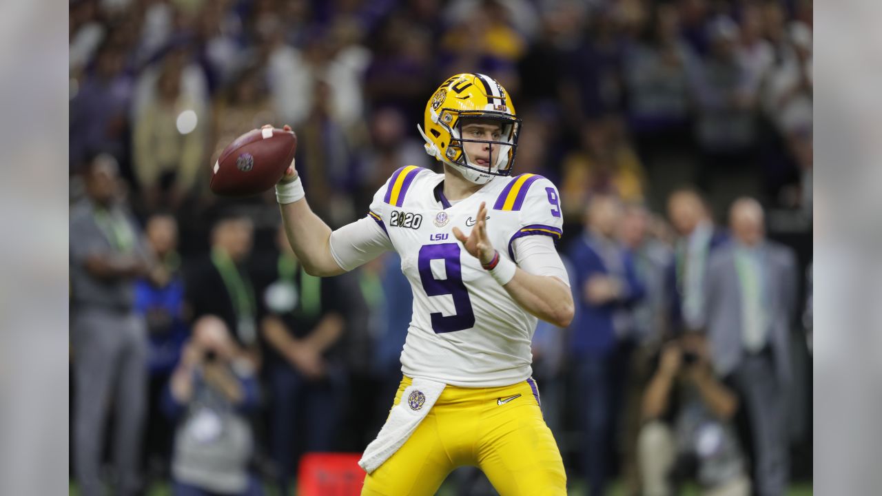 Joe Burrow LSU Tigers Unsigned White Jersey Drop Back Pass Photograph