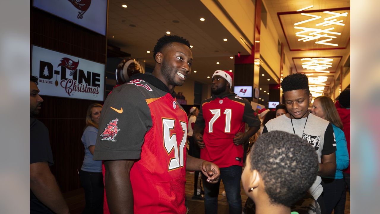 Bucs D-Line delivers special Christmas for kids