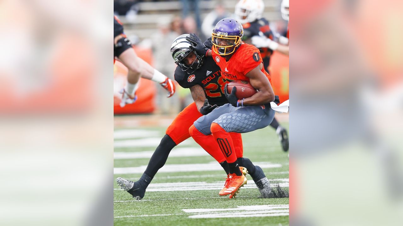 South squad running back Donnel Pumphrey of San Diego State, center is  tackled during the first half of the Senior Bowl NCAA college football game  against North, Saturday, Jan. 28, 2017, at