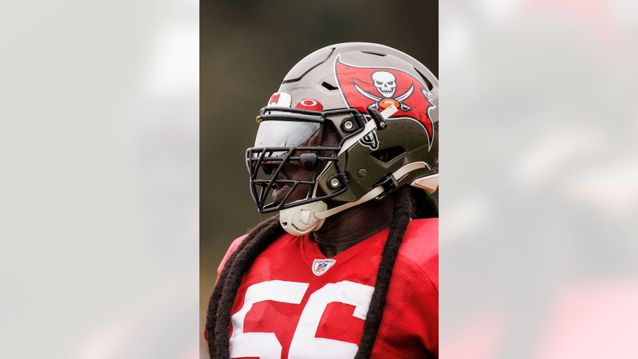 Tampa Bay Buccaneers defensive tackle Rakeem Nunez-Roches (56) with a smart  phone celebrating after an NFL football game against the Seattle Seahawks  on Nov. 13, 2022, in Munich. The Buccaneers defeated the