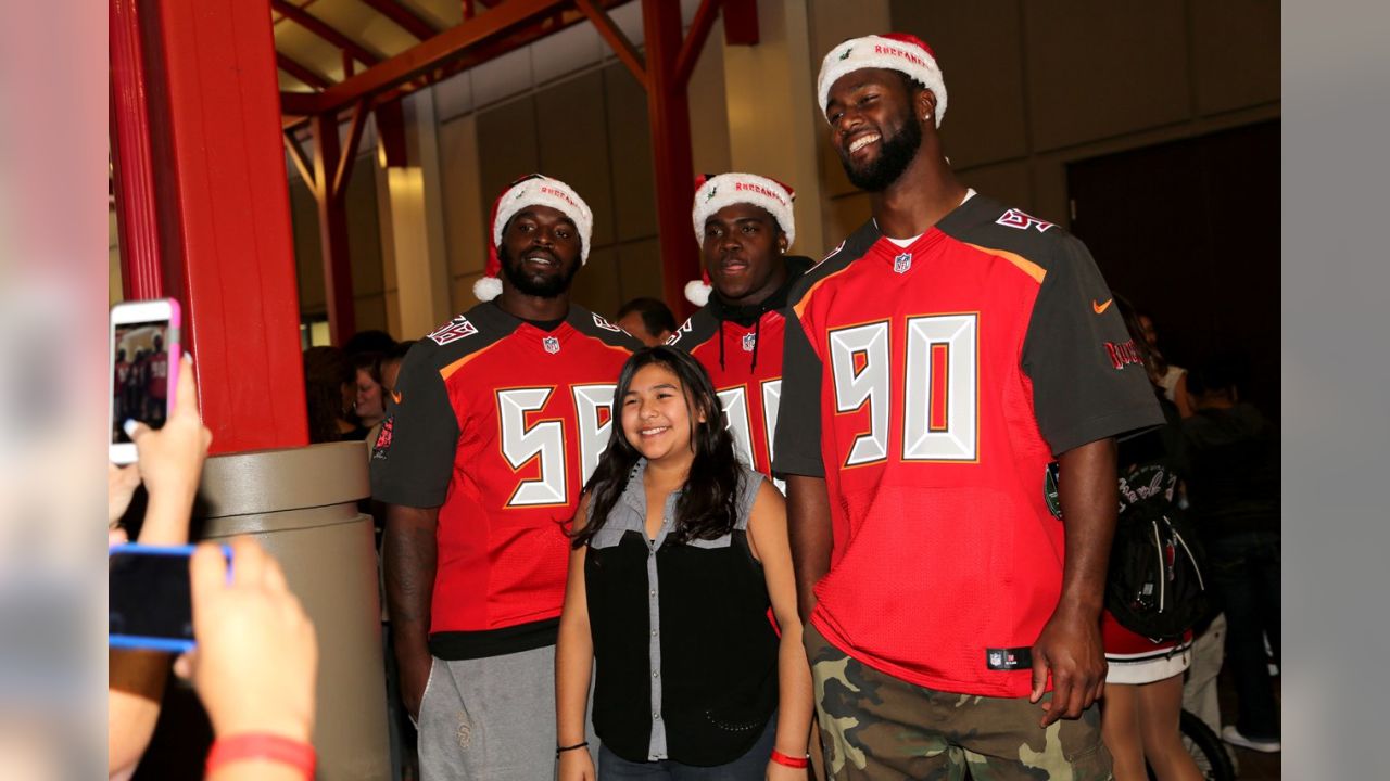 Bucs D-Line delivers special Christmas for kids