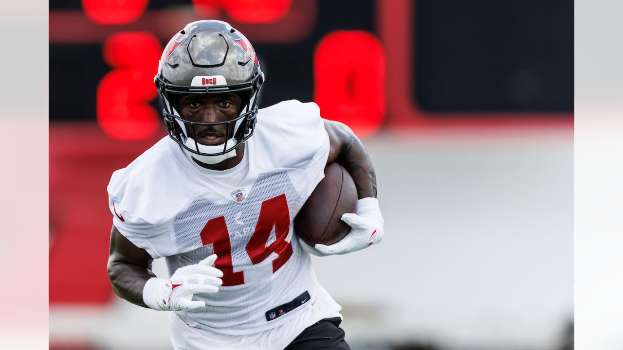 Cade Otton of the Tampa Bay Buccaneers in action against the New