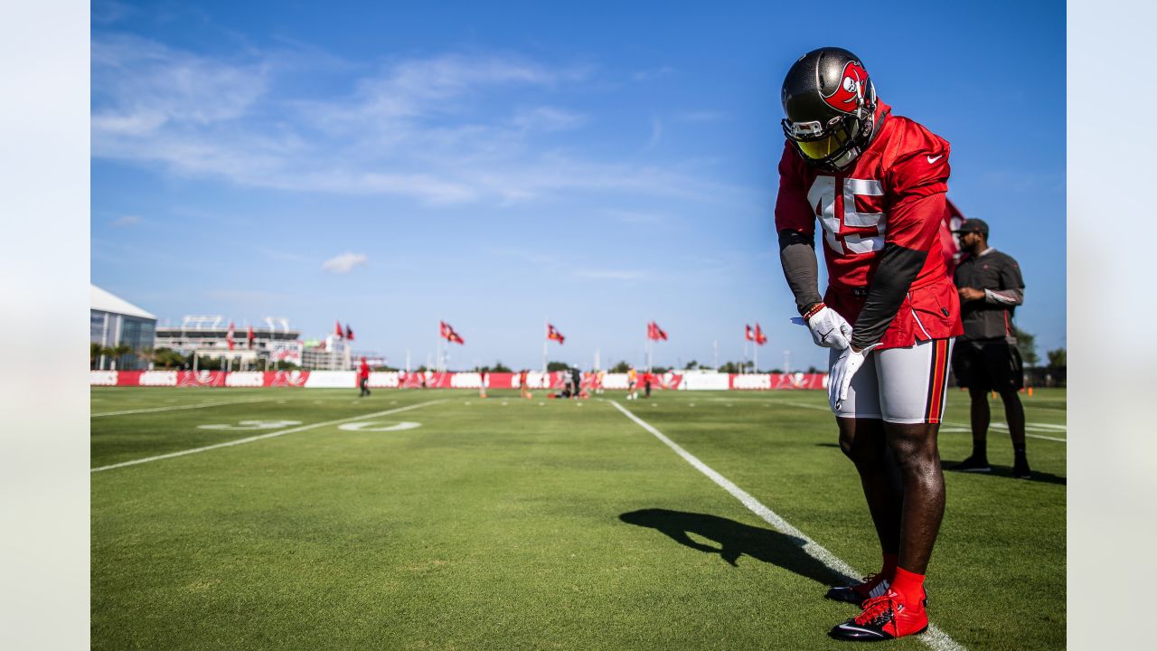 Tampa Bay Buccaneers defensive tackle Rakeem Nunez-Roches (56) with a smart  phone celebrating after an NFL football game against the Seattle Seahawks  on Nov. 13, 2022, in Munich. The Buccaneers defeated the