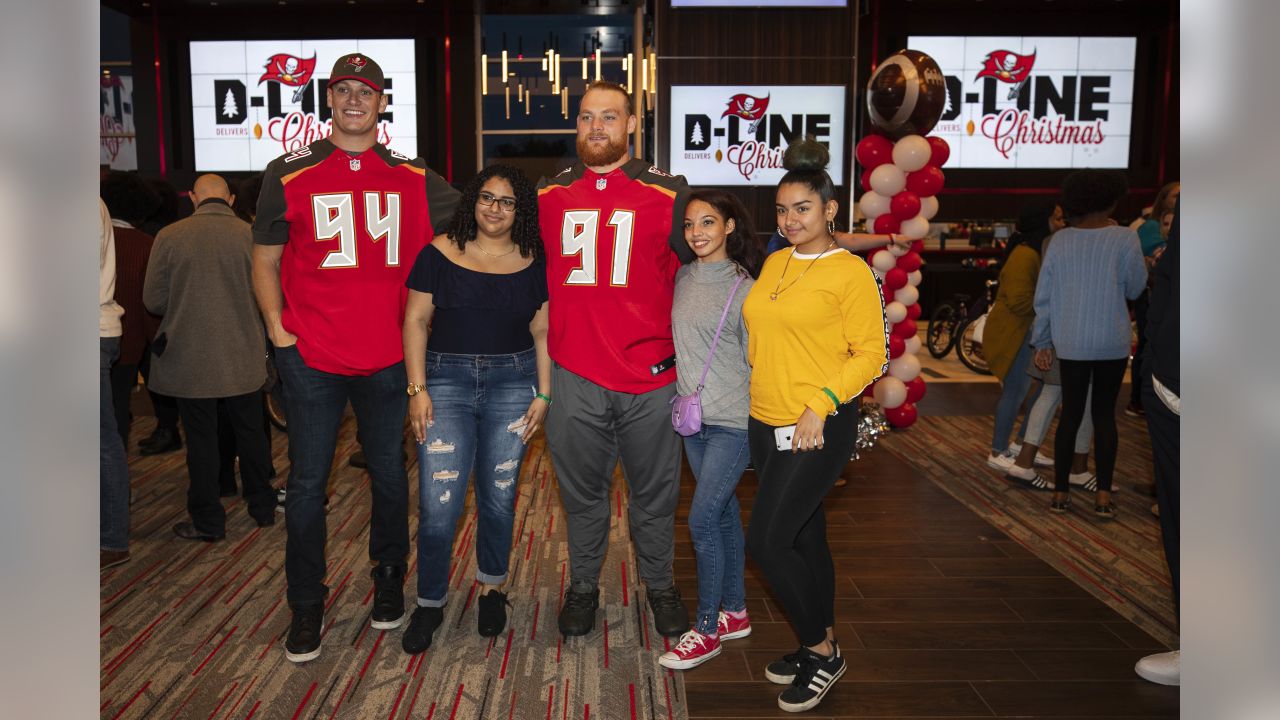 Bucs D-Line delivers special Christmas for kids