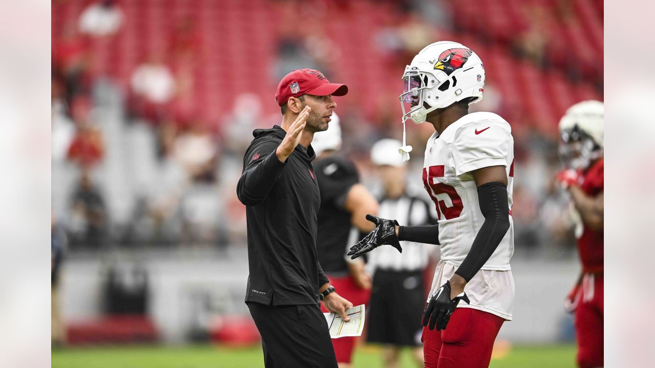 Arizona Cardinals wide receiver Rondale Moore, right, runs with the ball as  Cardinals safety Jalen Thompson, left, closes in during NFL football  training camp practice at State Farm Stadium Saturday, July 29