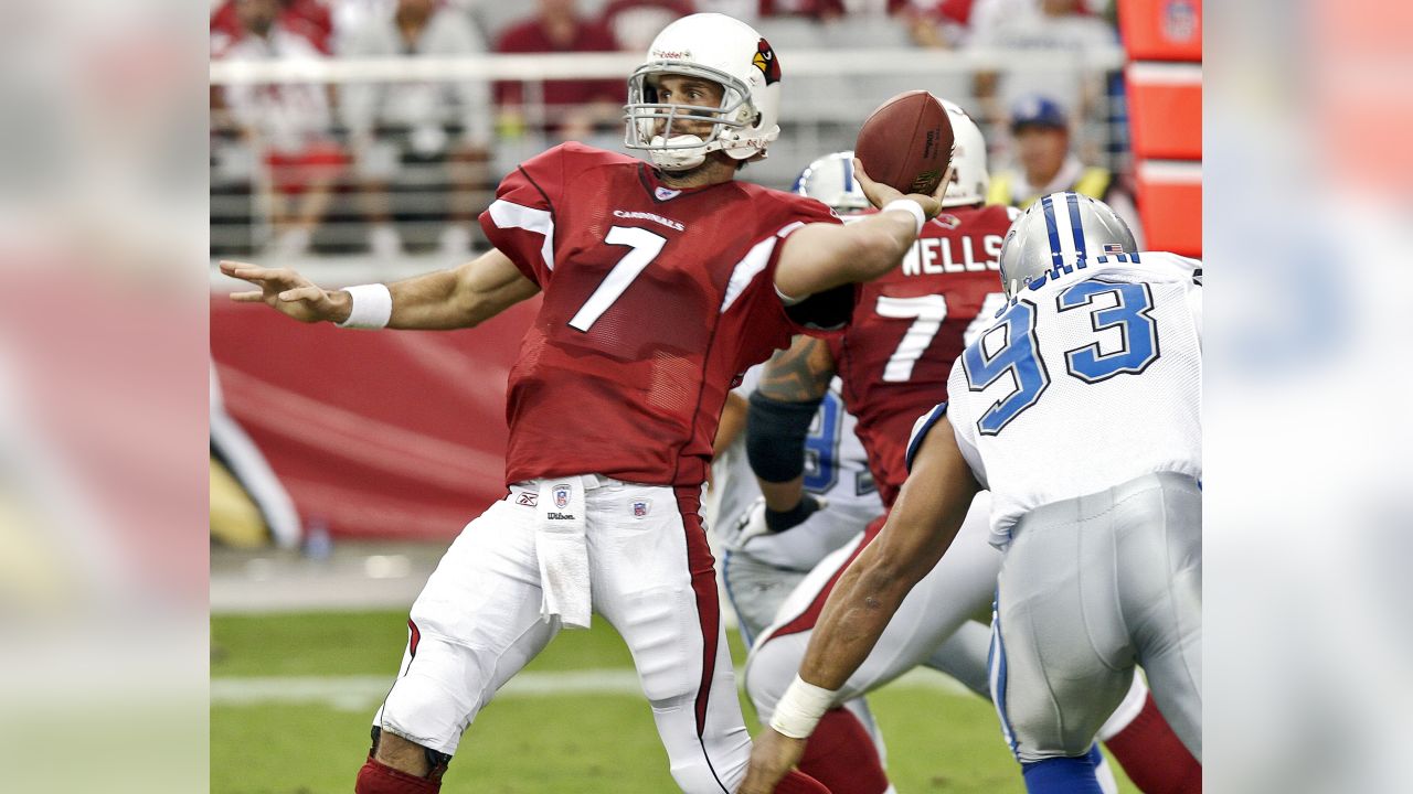 Arizona Cardinals' Fred Wakefield (87) and Detroit Lions Ernie Sims (80)  are separated by line judge Ron Marinucci during the second quarter of  their football game Sunday, Nov. 19, 2006, in Glendale