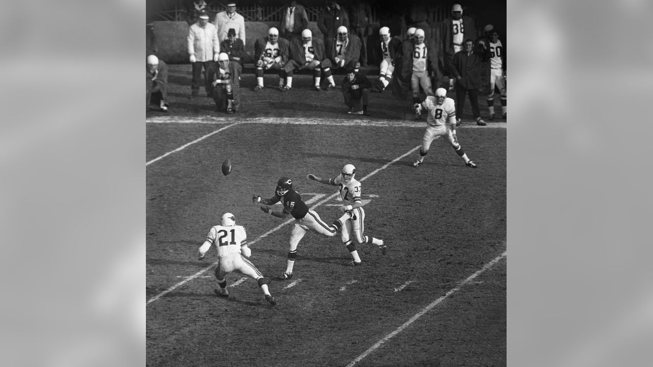 Dick Butkus (51) of the Chicago Bears is seen tackling Willie Crenshaw (33)  of the St.