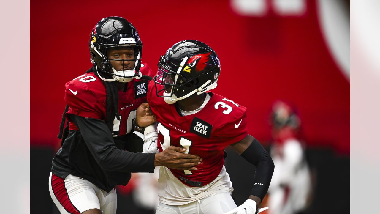 Arizona Cardinals' Will Hernandez (76) and J.J. Watt (99) walk off the  field after their 42-34 win over the New Orleans Saints in an NFL football  game Thursday, Oct. 20, 2022, in