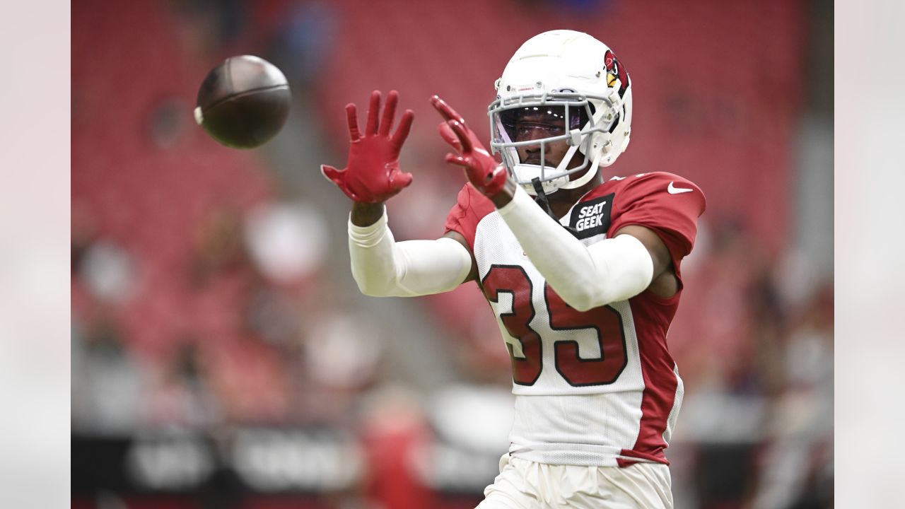 Arizona Cardinals linebacker Myjai Sanders (41) and Cardinals linebacker  Zaven Collins (25) celebrate a defensive stop against the Los Angeles  Chargers during the first half of an NFL football game in Glendale