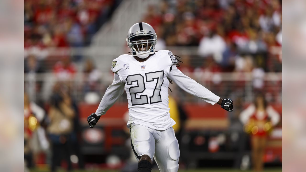 Oakland Raiders Reggie Nelson (27) celebrates intercepting pass