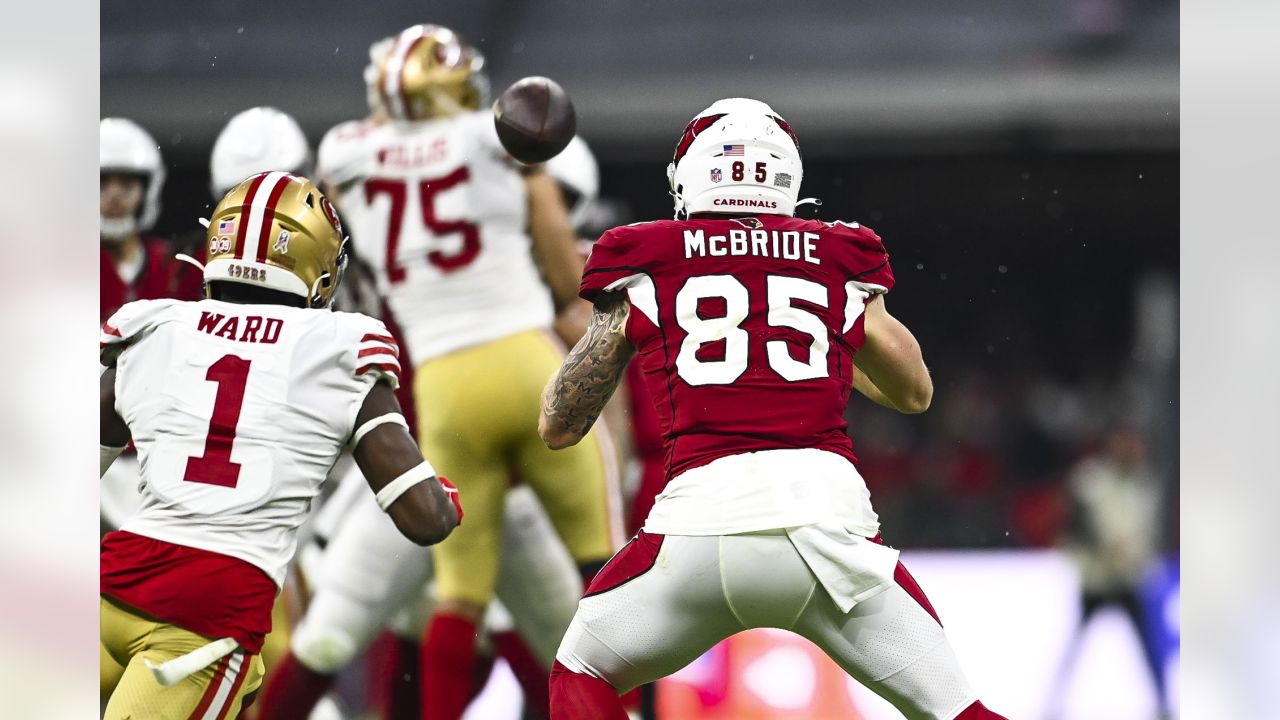 Arizona Cardinals vs. San Francisco 49ers. NFL Game. American Football  League match. Silhouette of professional player celebrate touch down.  Screen in background. Stock Photo