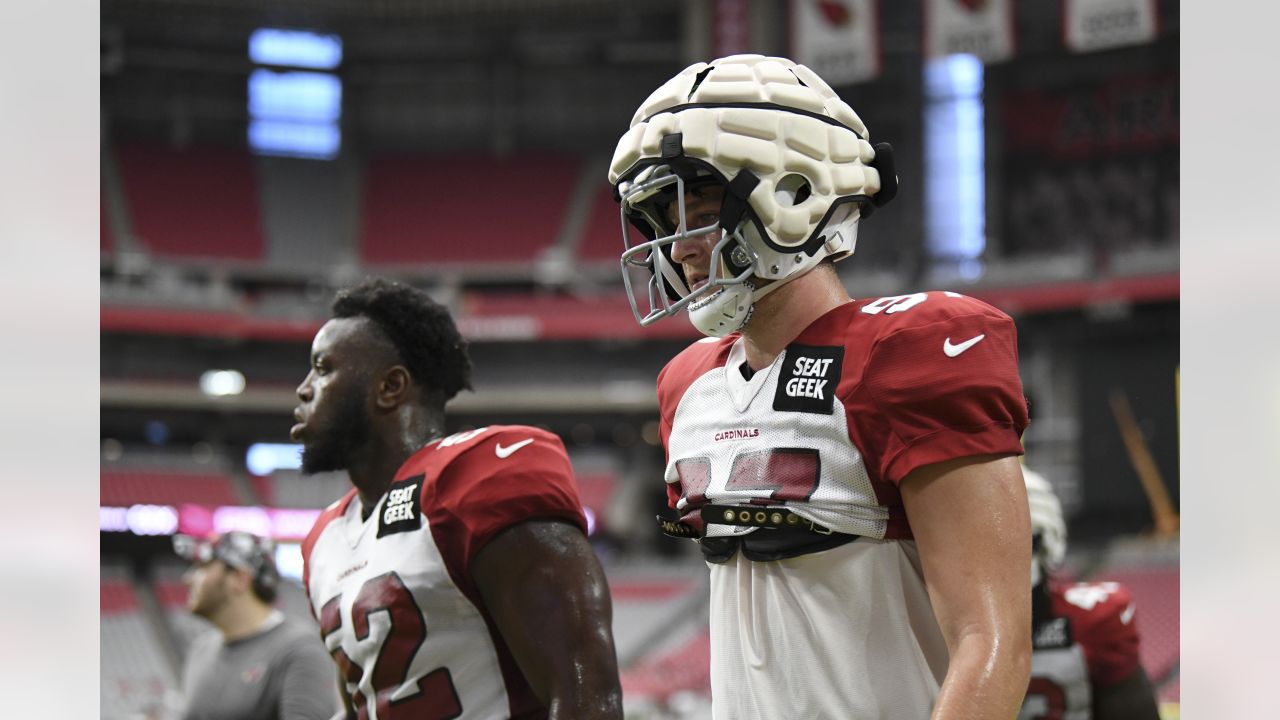 Arizona Cardinals linebacker Myjai Sanders (41) and Cardinals linebacker  Zaven Collins (25) celebrate a defensive stop against the Los Angeles  Chargers during the first half of an NFL football game in Glendale