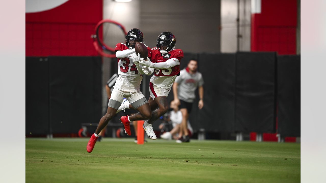 Arizona Cardinals' Will Hernandez (76) and J.J. Watt (99) walk off the  field after their 42-34 win over the New Orleans Saints in an NFL football  game Thursday, Oct. 20, 2022, in