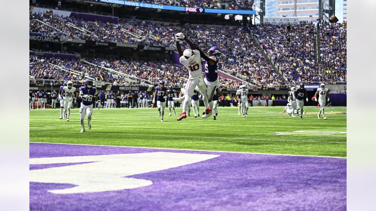 Arizona Cardinals wide receiver Davion Davis (10) runs down the field  during the first half of an NFL preseason football game against the  Minnesota Vikings, Saturday, Aug. 26, 2023, in Minneapolis. (AP