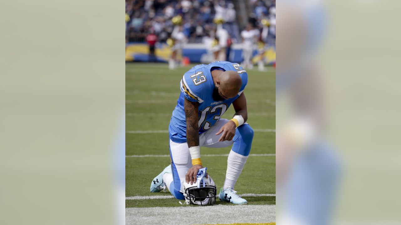 Carolina Panthers free safety Tre Boston (33) and cornerback Troy Pride  (25) stop Los Angeles Chargers wide receiver Keenan Allen after a catch and  run during the second half of an NFL