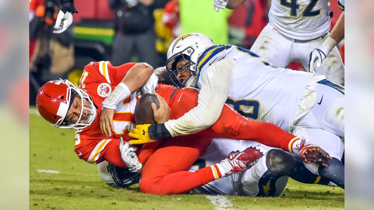 Kansas City Chiefs quarterback Patrick Mahomes runs the ball during the  second half of an NFL football game against the Los Angeles Chargers  Sunday, Sept. 26, 2021, in Kansas City, Mo. (AP