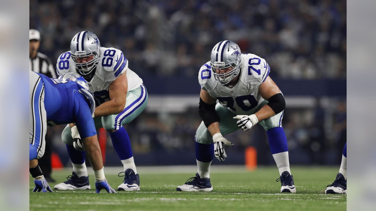 Dallas Cowboys quarterback Dak Prescott (4) alongside Tyron Smith (77)  during a Thanksgiving day NFL football game against the Las Vegas Raiders,  Thursday, Nov. 25, 2021, in Arlington, Texas. (AP Photo/Matt Patterson