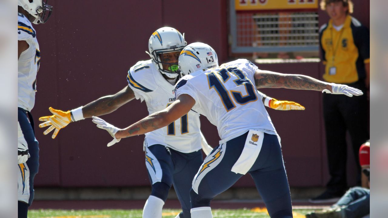 Carolina Panthers free safety Tre Boston (33) and cornerback Troy Pride  (25) stop Los Angeles Chargers wide receiver Keenan Allen after a catch and  run during the second half of an NFL