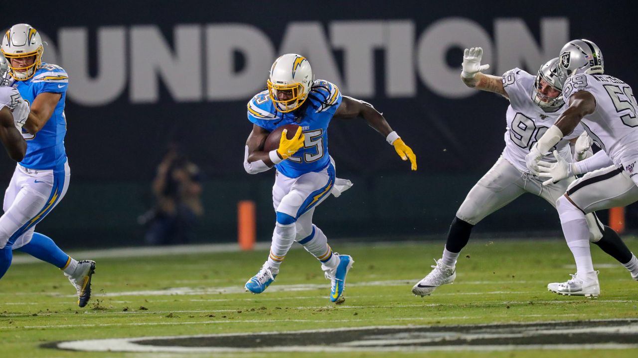 Los Angeles Chargers running back Melvin Gordon (28) runs the ball against  the Oakland Raiders during an NFL football game Sunday, Nov. 11, 2018, in  Oakland, CA. The Chargers won 20-6. (Daniel