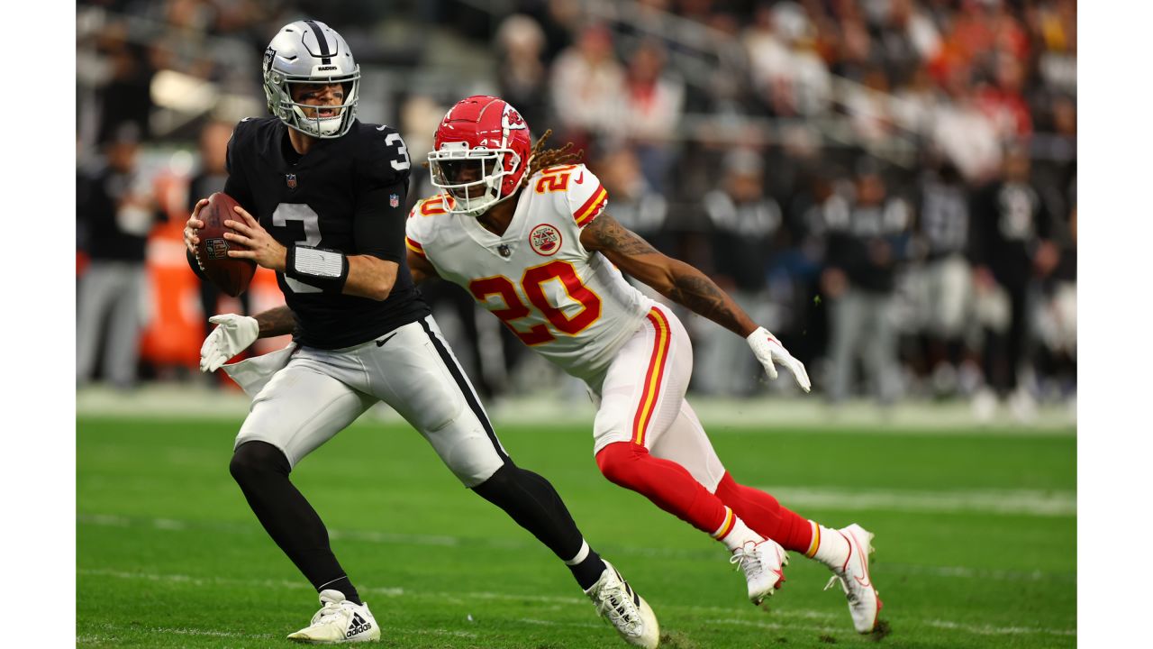 Kansas City Chiefs tight end Travis Kelce (87) and Kansas City Chiefs  linebacker Leo Chenal (54) greet each other during warmups before an NFL  divisional round playoff football game against the Jacksonville