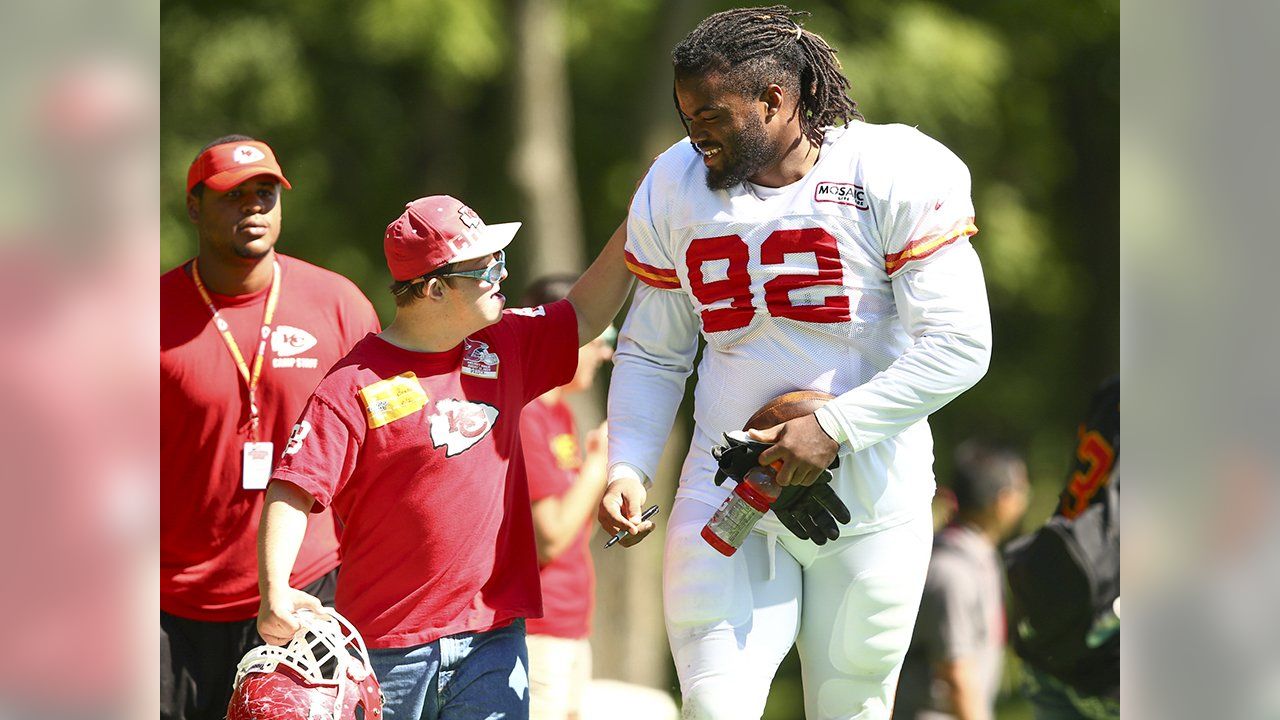 Kansas City Chiefs linebackers Justin Houston (50) and Tamba Hali (91) walk  between drills at NFL football t…