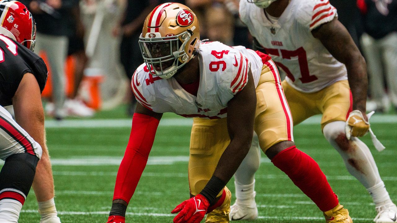 San Francisco 49ers defensive end Charles Omenihu poses with San