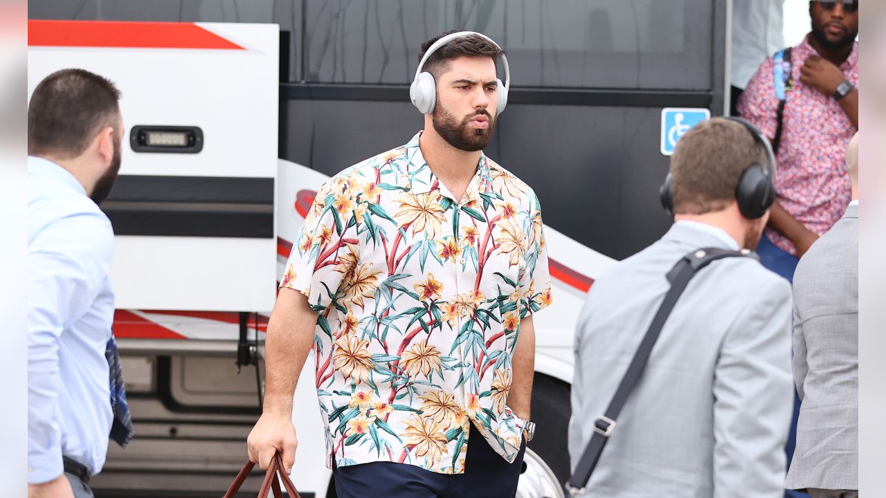 Chiefs players wearing red Hawaiian shirts on Flight to Miami