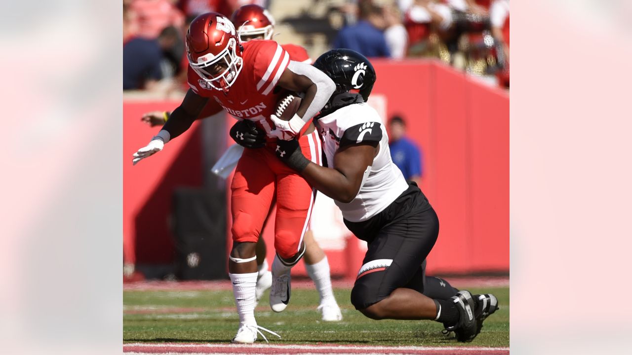 Curtis Brooks of the Washington Commanders runs as he takes the field  News Photo - Getty Images