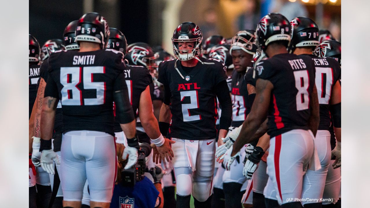 First look: Recently acquired quarterback Matt Ryan holds his new  Indianapolis Colts jersey following his trade away from the Atlanta Falcons.