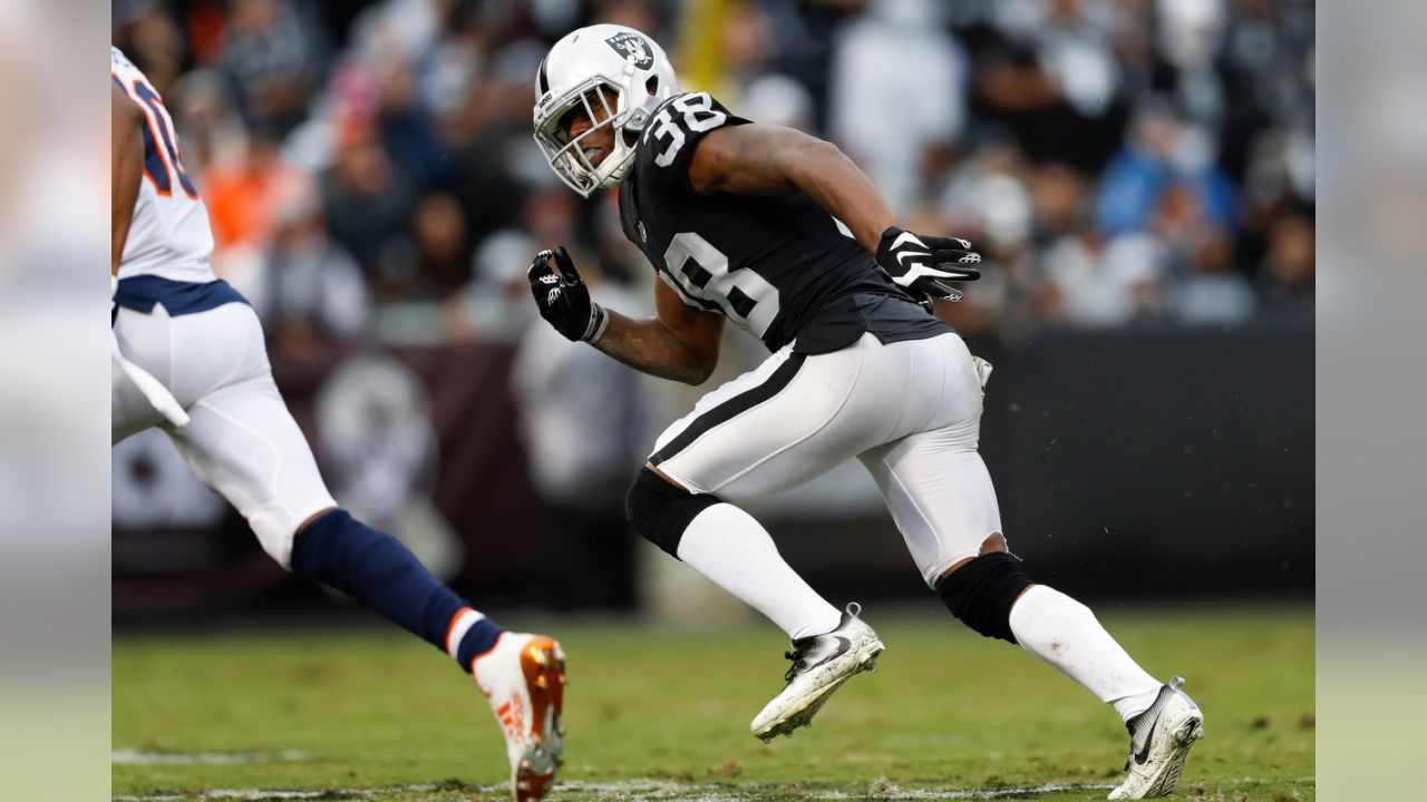 Oakland Raiders cornerback T.J. Carrie (38) breaks up a pass